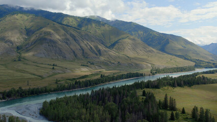Naklejka premium Blue Katun river in the middle of mountains of Ak-Kem valley in Altai