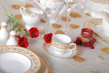 White premium porcelain tableware plates ready for dinner. Elegant table setting at home or restaurant with luxury dinnerware