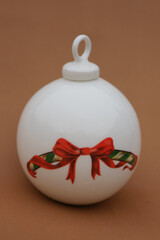 Porcelain globe for decorating the Christmas tree. Winter Holiday and Xmas ornament.