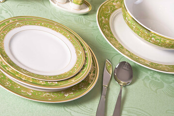 White porcelain tableware plates ready for dinner. Elegant table setting at home or restaurant with luxury dinnerware