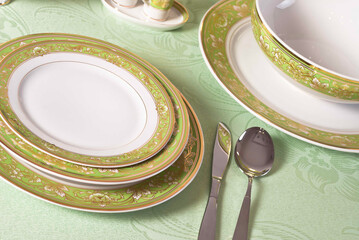 White porcelain tableware plates ready for dinner. Elegant table setting at home or restaurant with luxury dinnerware