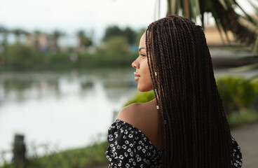 View from back of girl with rblack dreadlocks from kanekalon.