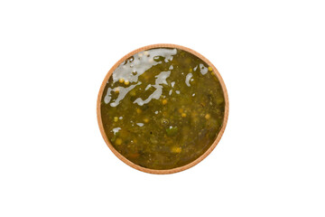 Bowl of pesto sauce isolated on white background. top view