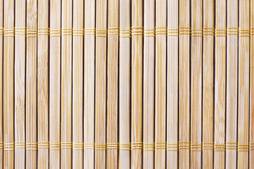 Sushi rolling mat of the natural bamboo wood color beige background texture  - Powered by Adobe
