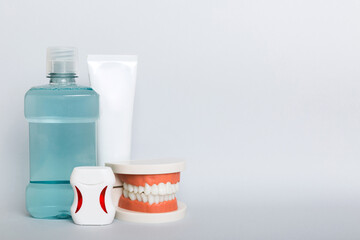 Mouthwash and other oral hygiene products on colored table top view with copy space. Flat lay. Dental hygiene. Oral care kit. Dentist concept