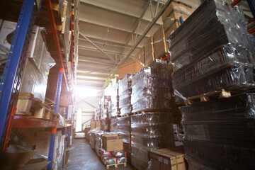 Warehouse store stock. Industrial warehouse. Warehouse of a trade organization. Goods and materials arranged on a rack in warehouse.