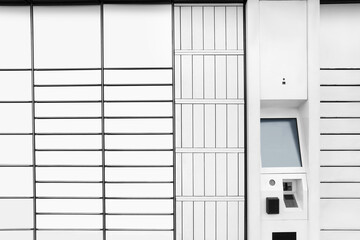 Modern parcel locker with many postal boxes as background