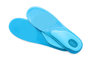 Light blue orthopedic insoles isolated on white, top view