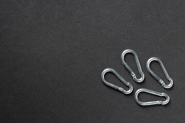4mm climbing carabiner isolated against a dark background