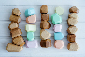 Toys made of natural wooden. No plastic toys. Colorful Montessori cubes.