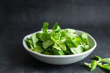 salad green mache leaves mung bean lettuce fresh healthy meal food snack diet on the table copy space food background rustic 