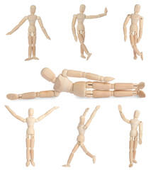 Set with wooden human models in different poses on white background