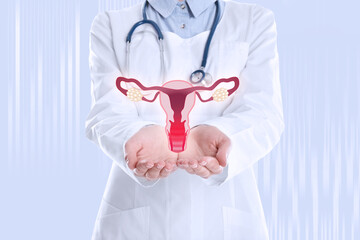 Doctor demonstrating virtual image of inflamed female reproductive system on light background, closeup. Vaginal candidiasis