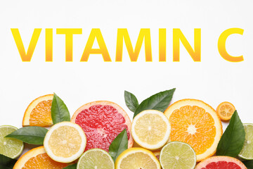 Source of Vitamin C. Fresh juicy citrus fruits with green leaves on white background, flat lay