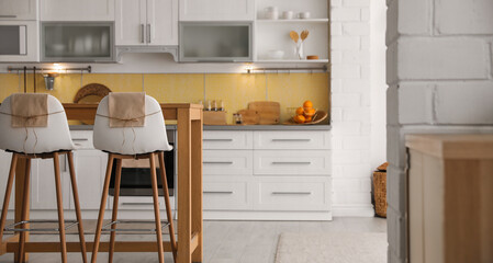 Modern kitchen interior with stylish wooden table. Banner design