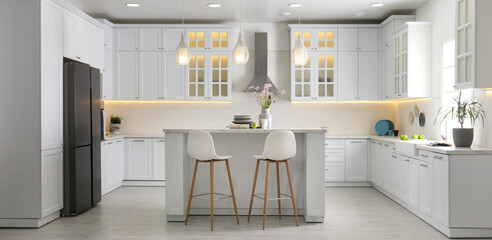 Modern kitchen interior with stylish white furniture - 514176689