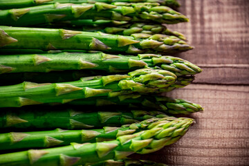 Fresh green asparagus on wooden background.
Delicious green asparagus image.