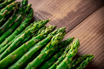 Fresh green asparagus on wooden background.
Delicious green asparagus image.