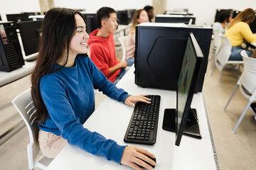 Young students using computers during business class at school - Focus on girl face