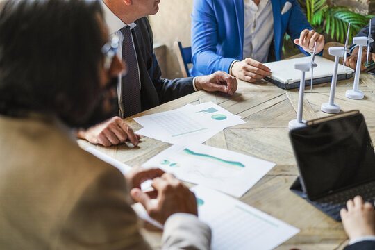 Business People Working On Sustainable Innovation Project - Focus On Senior Man Right Hand