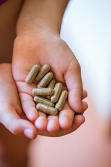 Pills in hands. Health concept