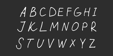 Fototapeta na wymiar Vector hand drawn english alphabet. Hand drawn letters white on black background.