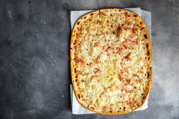 savory pie Flammkuchen bacon, onion, sour cream delicious pastries fresh meal food snack on the...