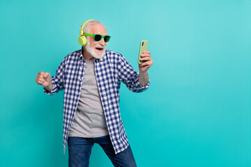Photo of confident hipster pensioner man have fun listening favorite music chatting with friends...