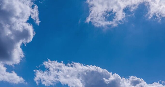 blue sky with clouds and airplane condensation trail timelapse