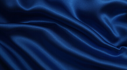 Smooth elegant blue silk or satin luxury cloth texture as abstract background. Luxurious Christmas background or New Year background design