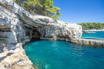 Fototapeta na wymiar Croatia, Istria, Pula, coastline with rocks and cave