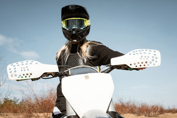 Motocross blondie. Female dirtbike rider.