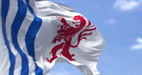 The flag of Nouvelle-Aquitaine waving in the wind on a clear day