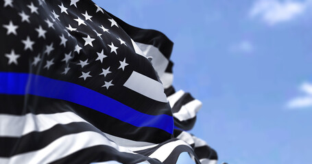 The flag of the United States of America in the Thin Blue Line variant waving in the wind
