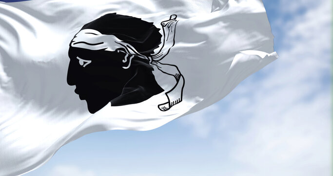 The flag of Corsica waving in the wind on a clear day