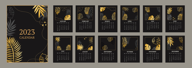 classic monthly calendar for 2023. Calendar with palm and monstera leaves, black and gold color