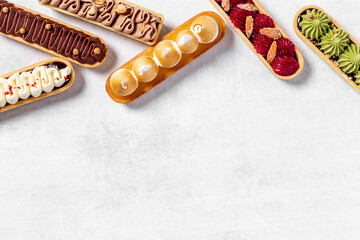Bakery banner background of eclairs colorful topping