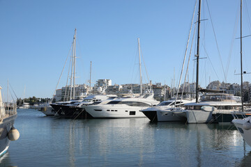 Fototapeta na wymiar Picturesque view of port with modern boats on sunny day