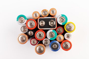 Composition with alkaline batteries on white background. Chemical waste. Top view.