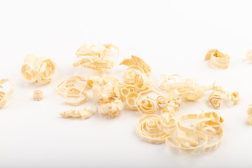 Wood chips isolated on light background. Wooden shavings.