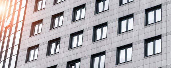 Exterior of building facade with many windows outdoor. Business centre view.