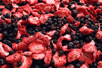 Closeup of freeze dried blueberries and strawberries as background