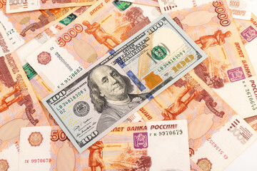 Fototapeta na wymiar US Dollar and Russian ruble. Money background. Currency exhange. Economic crisis. Rouble dollar cash. Hundred dollar bill and 5000 rubles. Business and finance. Russia and USA