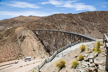 the train to the clouds passing through the famous cast iron bridge in northern argentina
