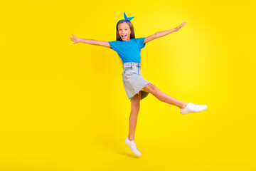 Fototapeta na wymiar Full body photo of excited overjoyed person jumping have fun good mood isolated on yellow color background