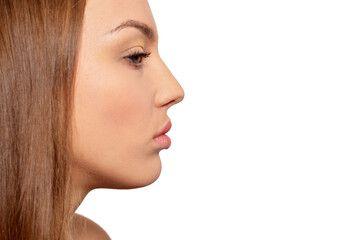 Fototapeta premium Side view of beautiful young woman on white background