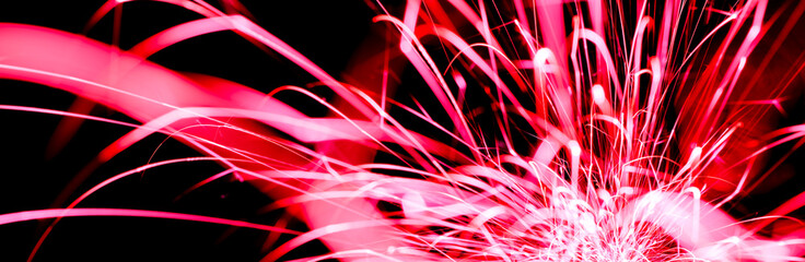 red sparks in the dark. lines of light.