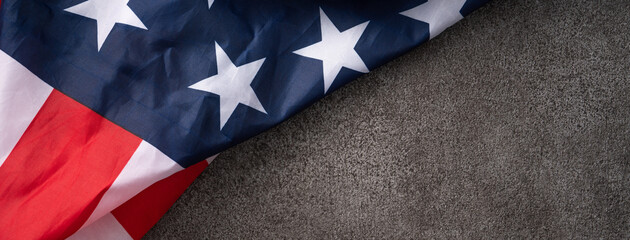 Concept of Independence day or Memorial day. Flag over dark gray table background.