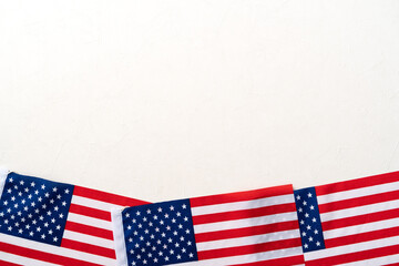 Obraz premium Concept of Independence day or Memorial day. Flag over bright marble table background.