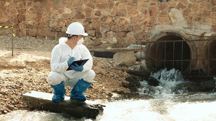 Ecologists sample water contaminated with dangerous, waterhazard toxins into tubes, Scientist or Biologist in protective waste water from industrial for analyze, problem environment, Testing toxic.